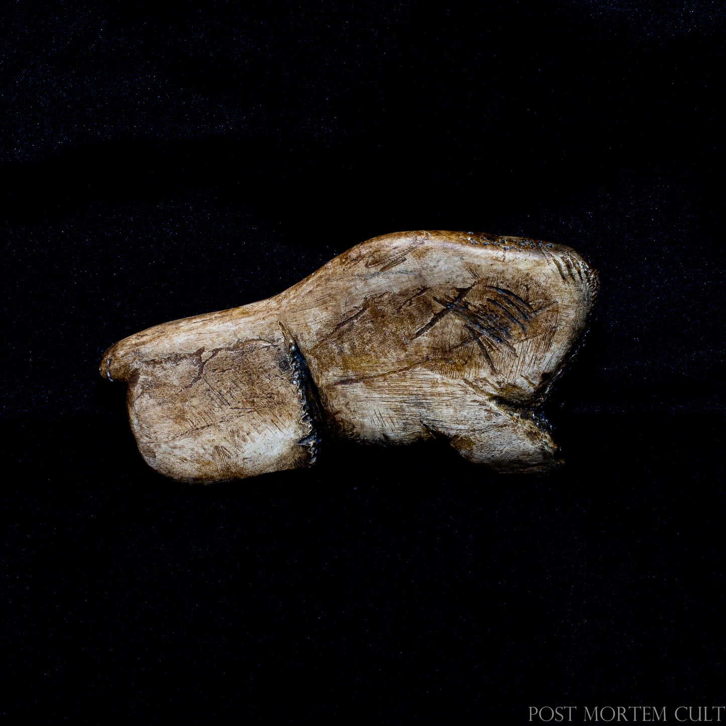 Close-up view highlighting the engraved fur textures, expressive eye and porous antler-inspired surface. Each piece is individually hand-painted using earthy pigments and archaeological finishes to recreate the appearance of ancient carved antler.