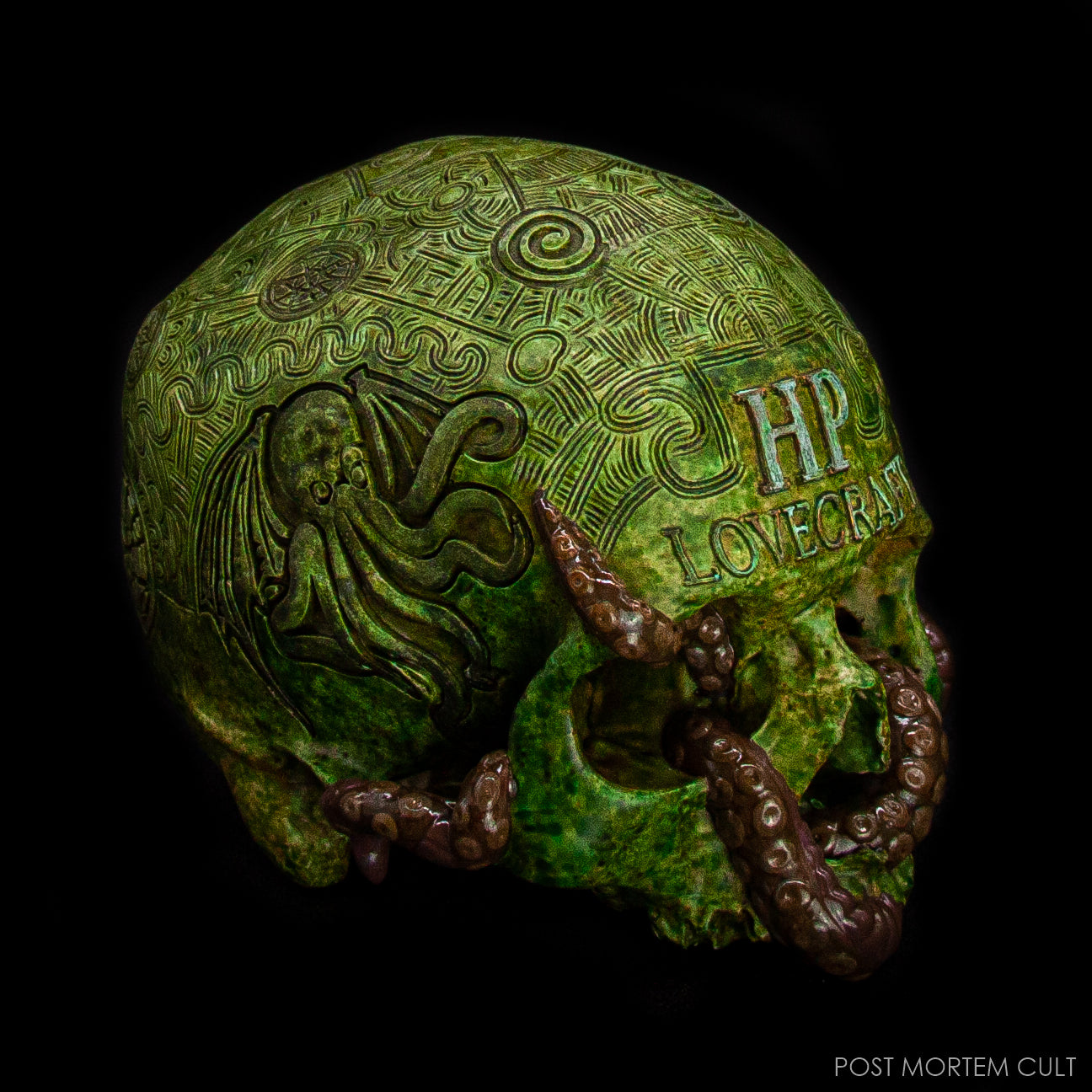Side profile of the Cthulhu-inspired Lovecraft skull sculpture with detailed carvings.