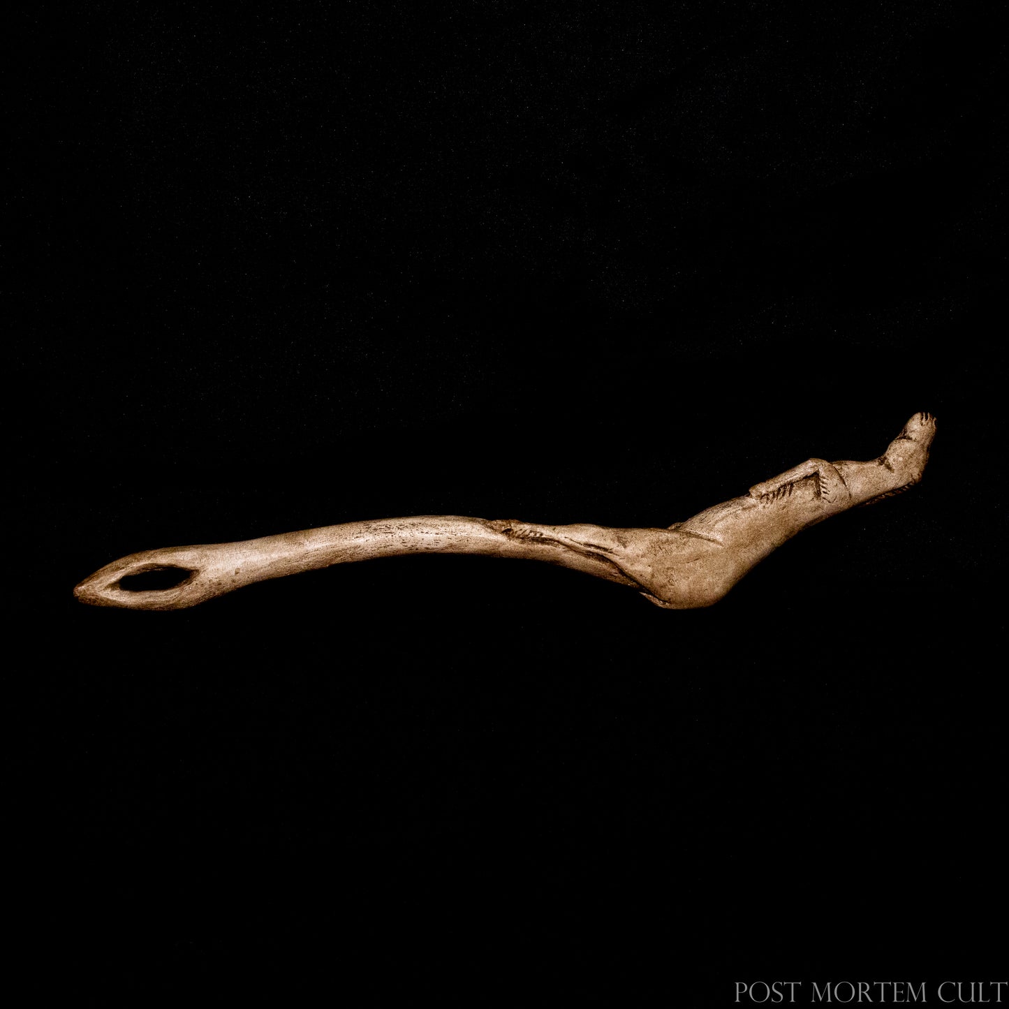 Close-up of the sculpted horse figure finished with earthy pigments and archaeological textures to recreate the appearance of aged carved antler.