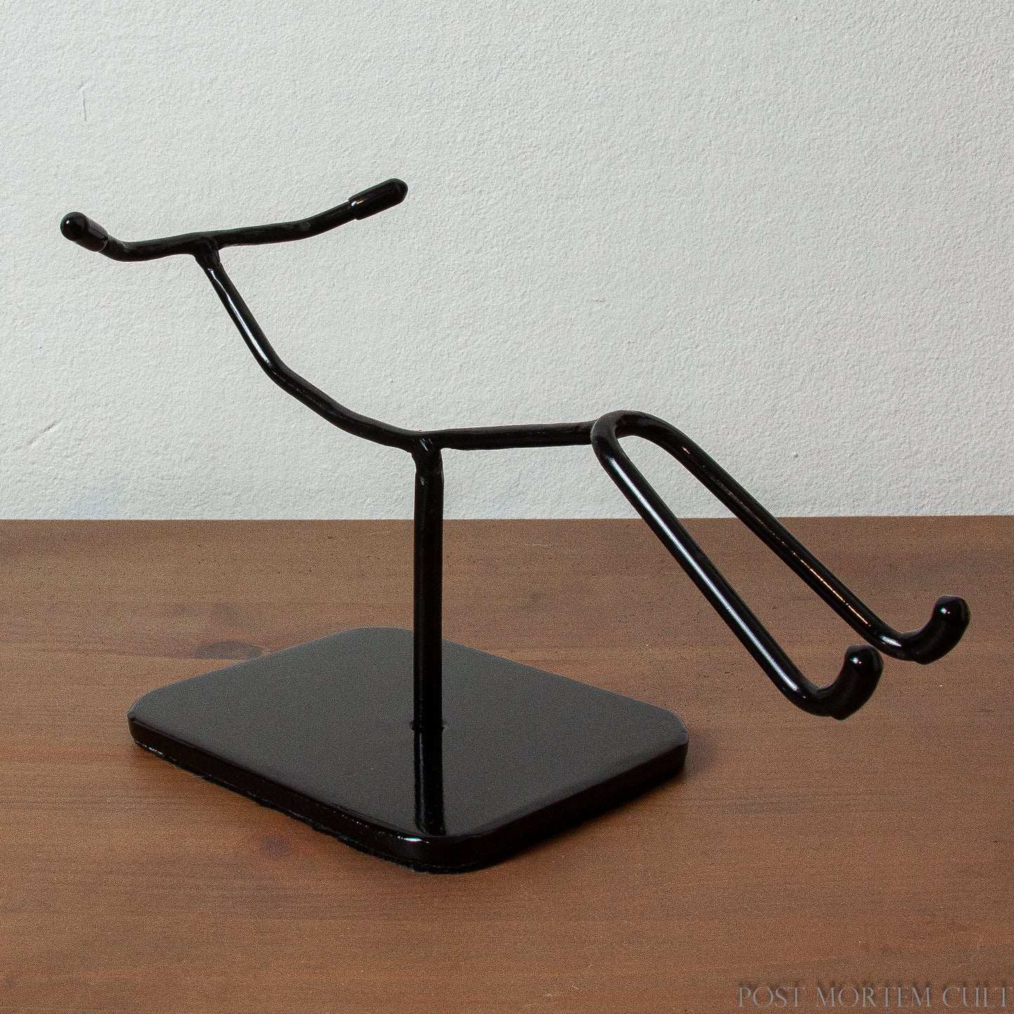 Elegant and Secure Display
This exclusive metal stand, designed specifically for elongated skulls, offers a sleek, minimalist look that perfectly complements your Paracas Skull. Made from durable steel, it ensures stability and protection with felt on the base and rubber tips.