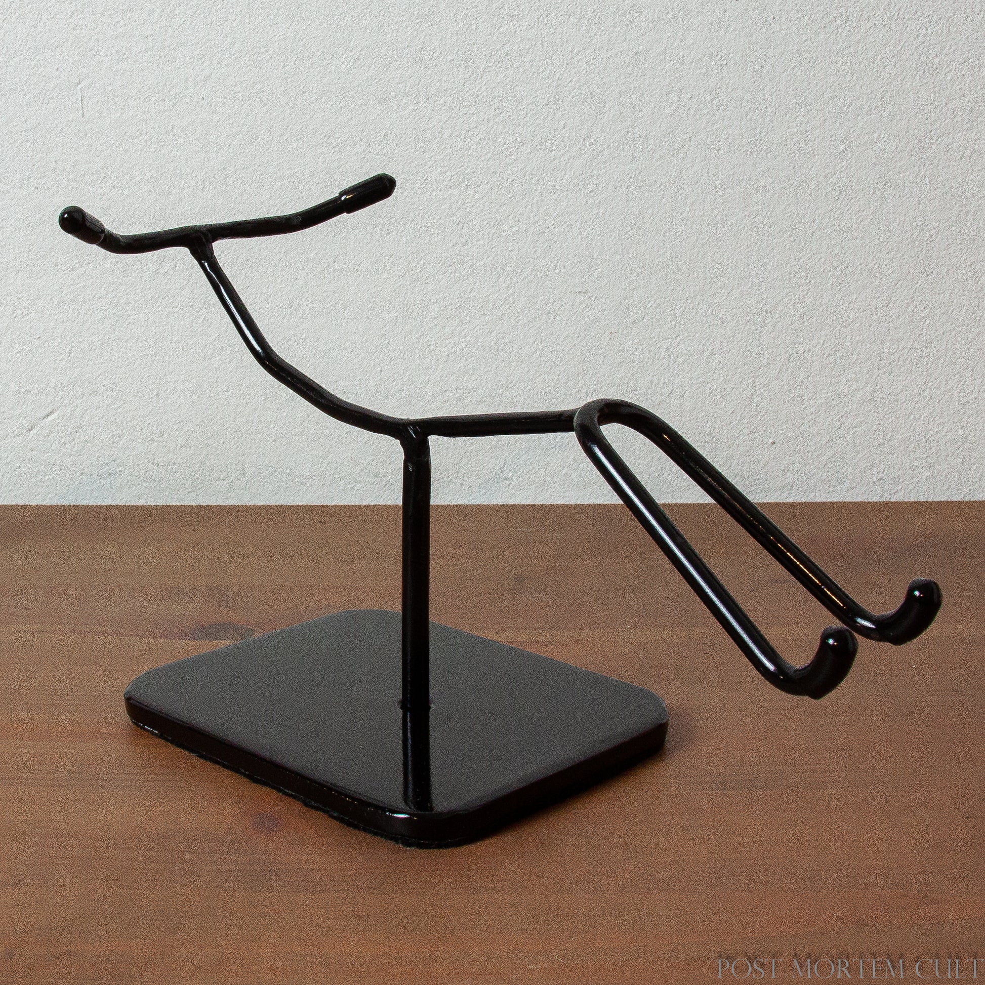Elegant and Secure Display
This exclusive metal stand, designed specifically for elongated skulls, offers a sleek, minimalist look that perfectly complements your Paracas Skull. Made from durable steel, it ensures stability and protection with felt on the base and rubber tips.