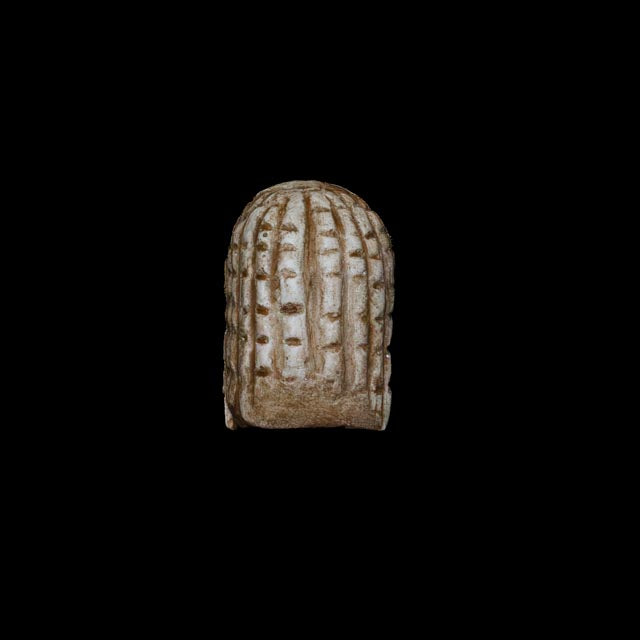 Rear view of the 1:1 Venus of Brassempouy replica showing the characteristic incised pattern of the Paleolithic figurine.