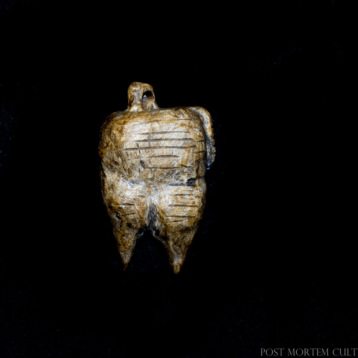 Side view of the 1:1 Venus of Hohle Fels replica showing carved details and hand-finished surface