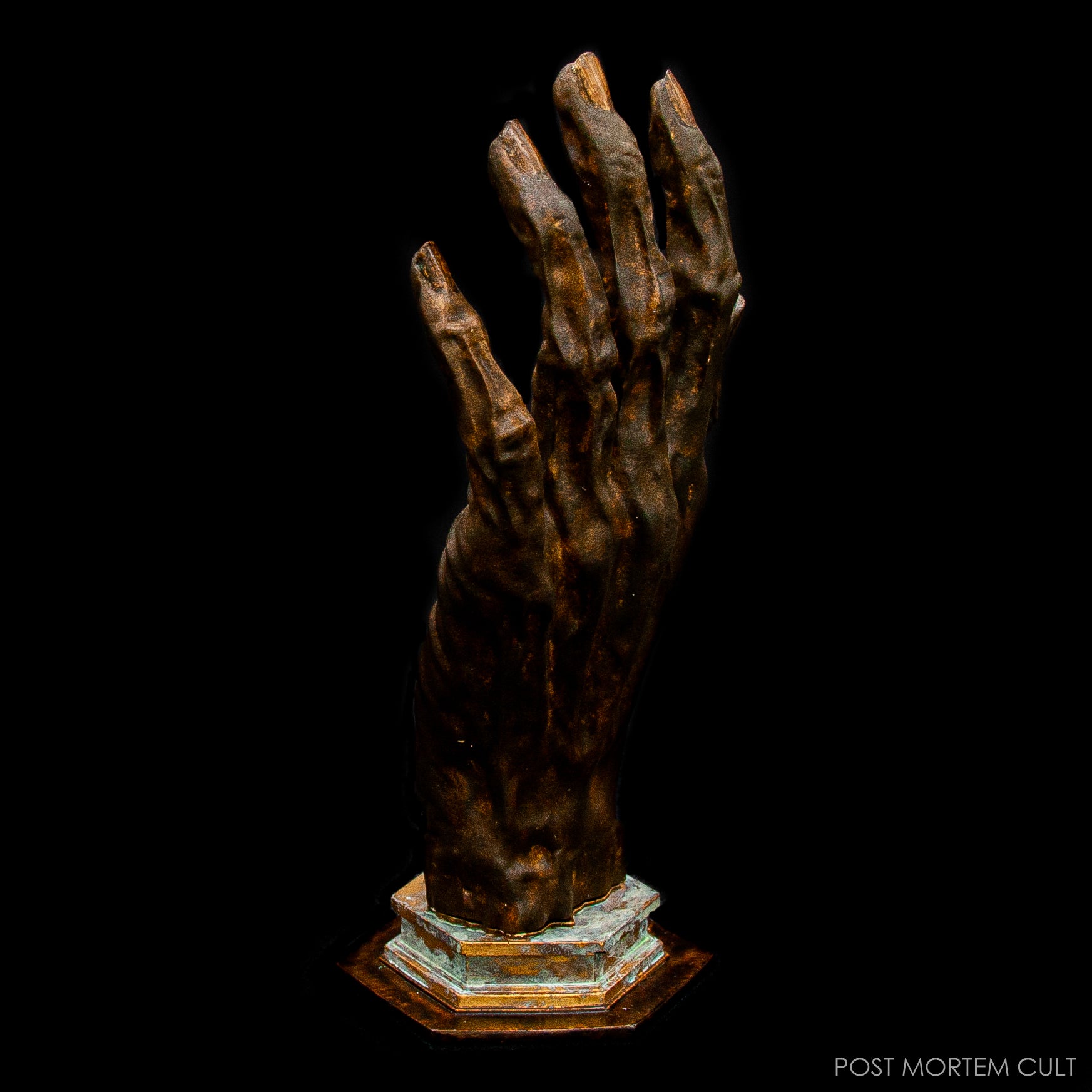 Detail of candle fingers and organic surface of the Hand of Glory resin sculpture.