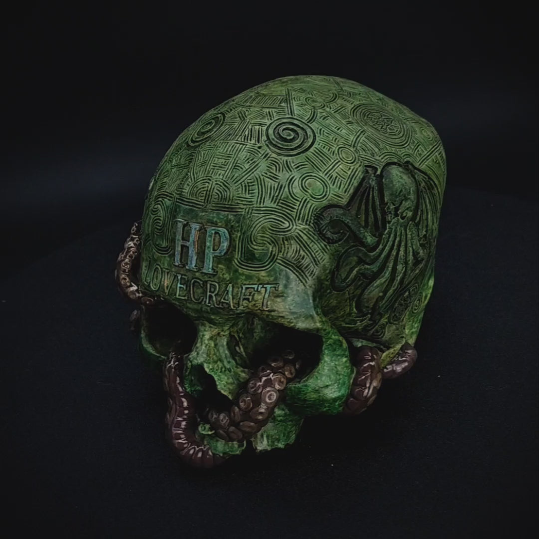 360-degree view of the H. P. Lovecraft Skull by Post Mortem Cult, showing every angle of the hand-painted verdigris patina, tentacle details, and glowing sigils inspired by Cthulhu mythology.