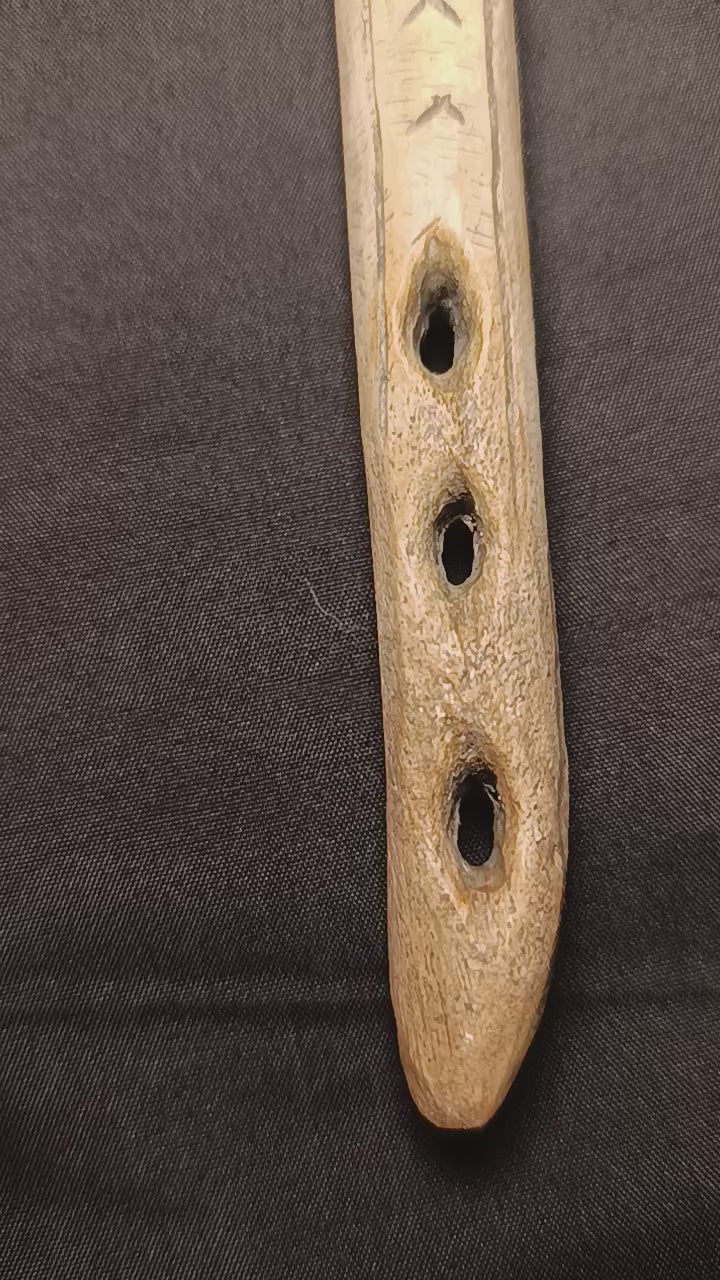 Mas d’Azil Faon aux Oiseaux spearthrower replica showing the complete sculpted form, engraved details and individually hand-painted surface inspired by aged carved antler. A reproduction of one of the distinctive decorated propulseurs associated with Magdalenian Paleolithic art.